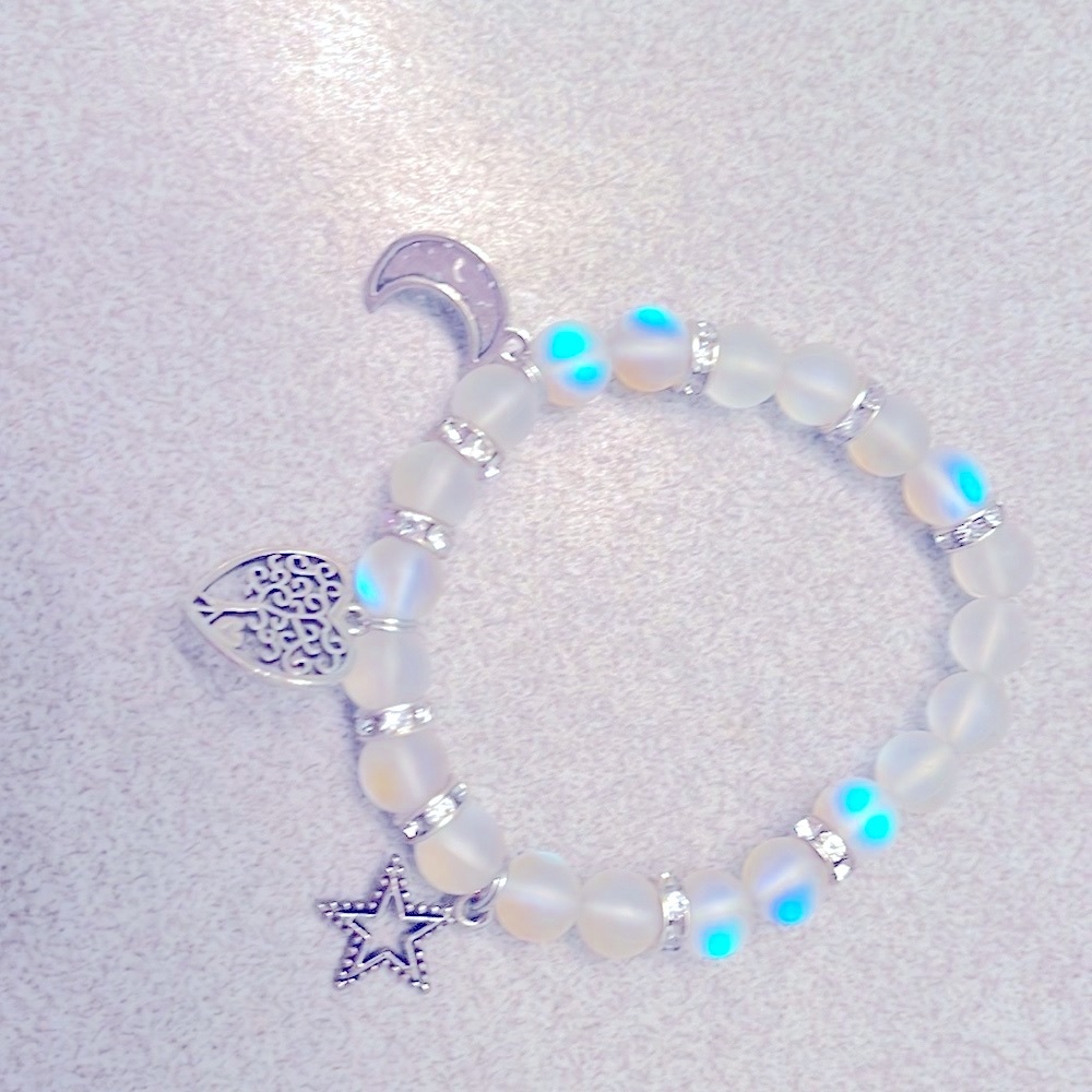 Beautiful glass beaded bracelet with star, moon and tree of life